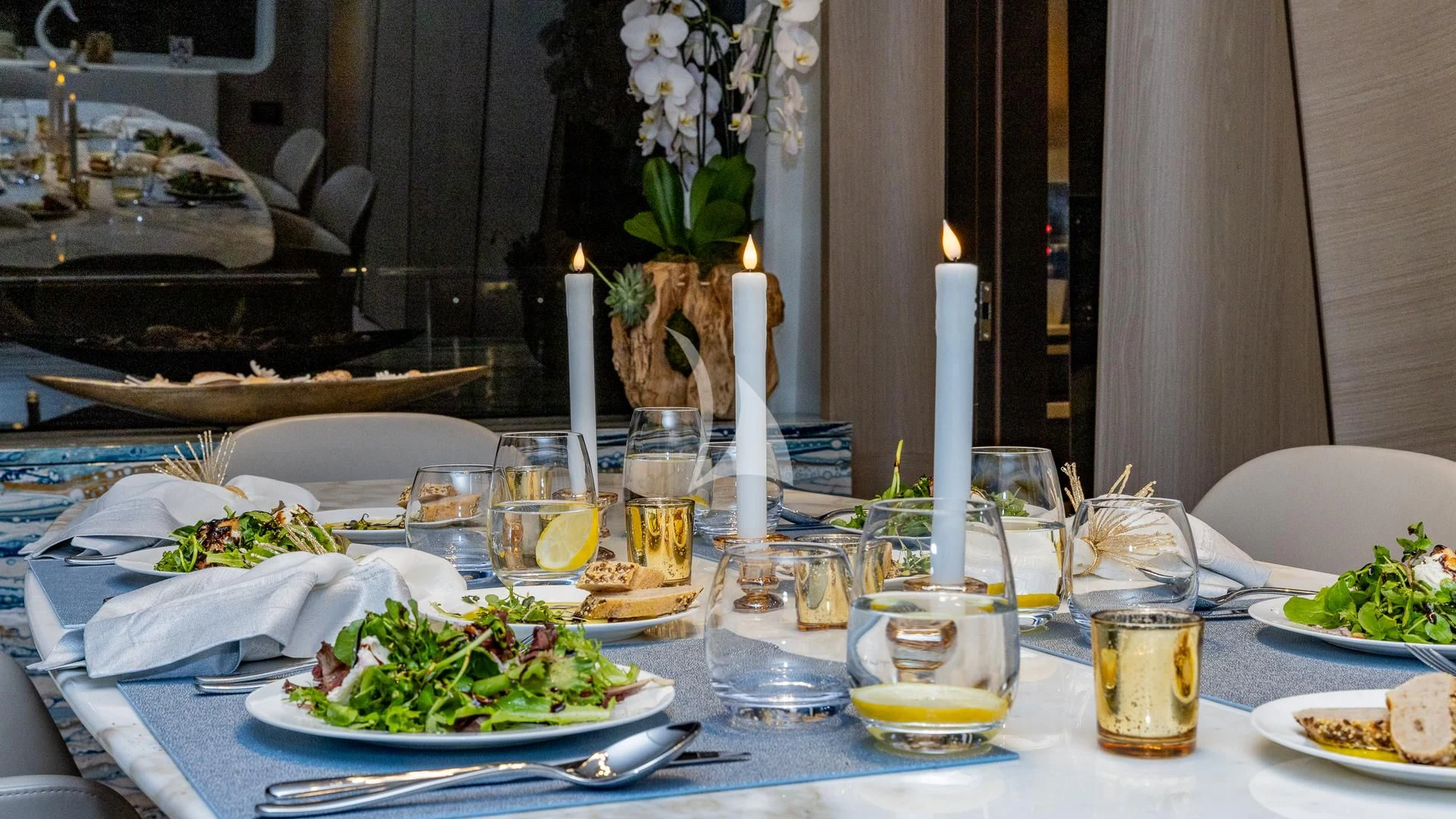 a table with plates and food on it aboard CAPTAIN MORGAN II Yacht for Sale