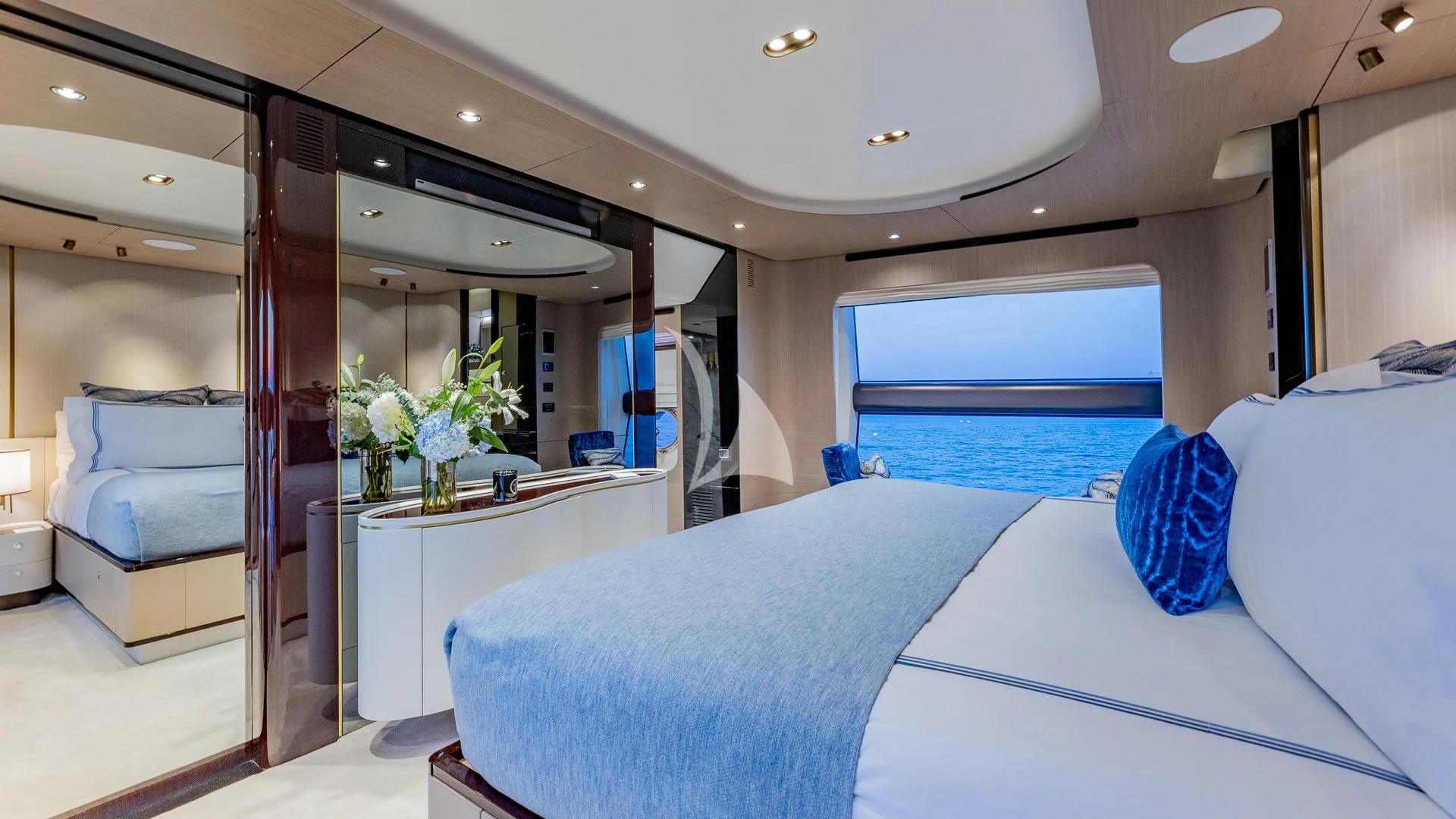 a room with a bed and a mirror aboard CAPTAIN MORGAN II Yacht for Sale