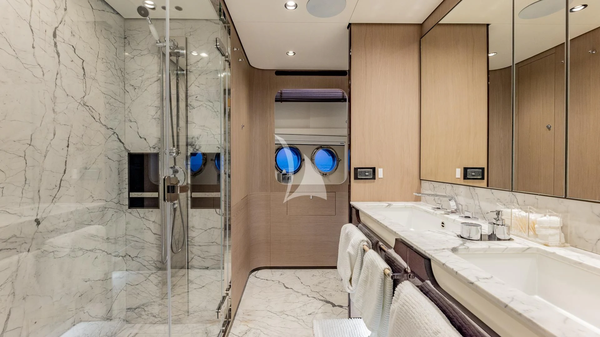 a bathroom with a shower and sinks aboard CAPTAIN MORGAN II Yacht for Sale
