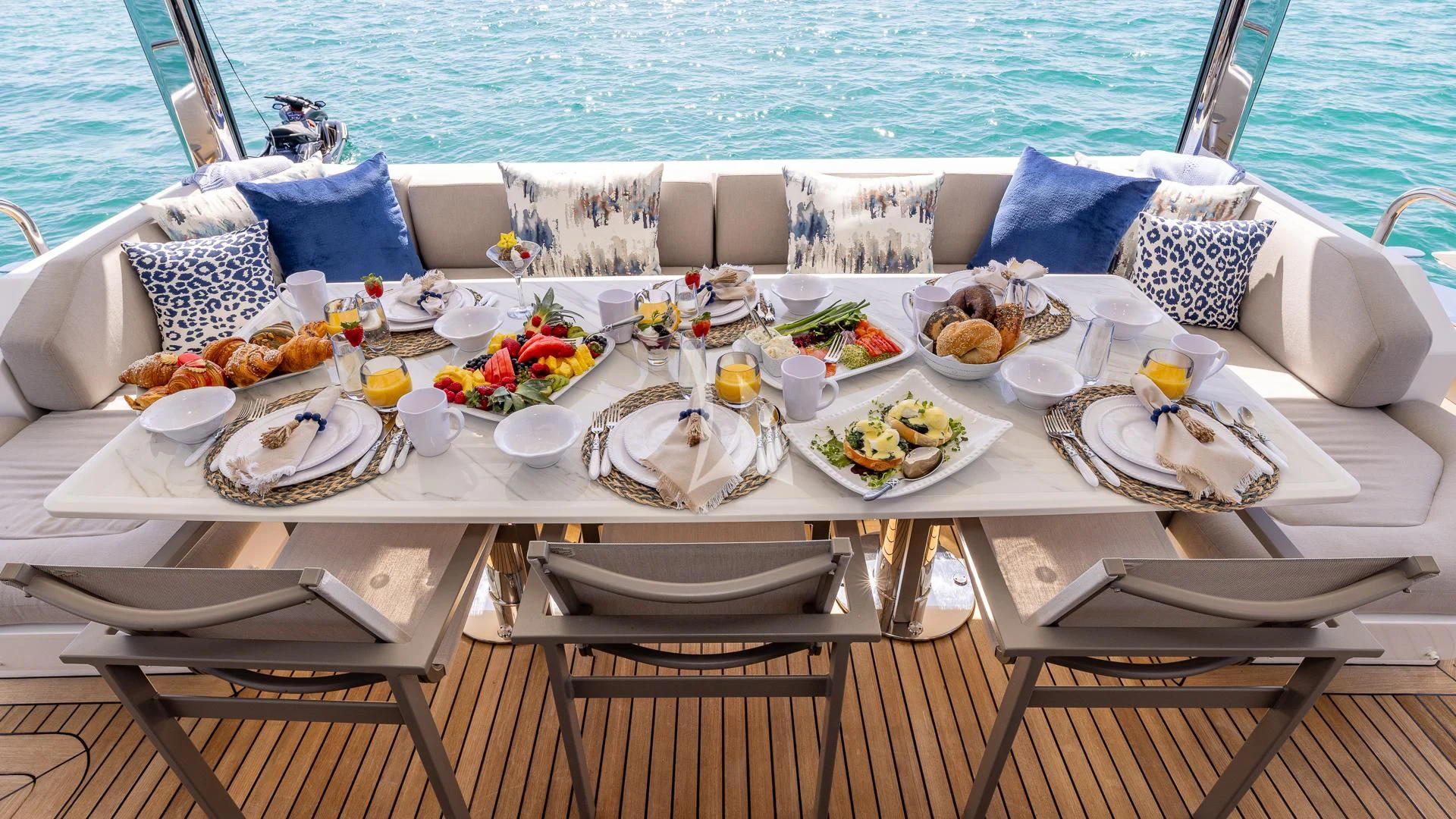 a table set for a dinner on a boat aboard CAPTAIN MORGAN II Yacht for Sale