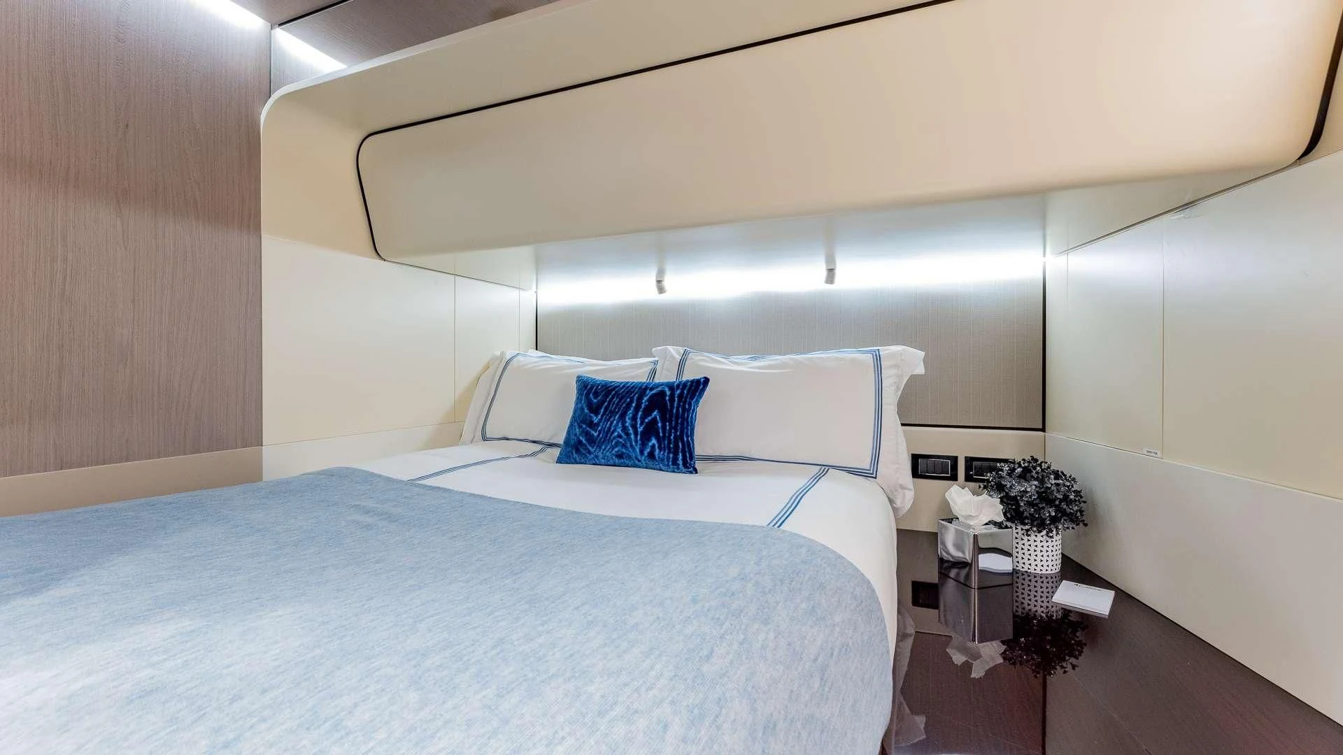 a bed with white sheets aboard CAPTAIN MORGAN II Yacht for Sale