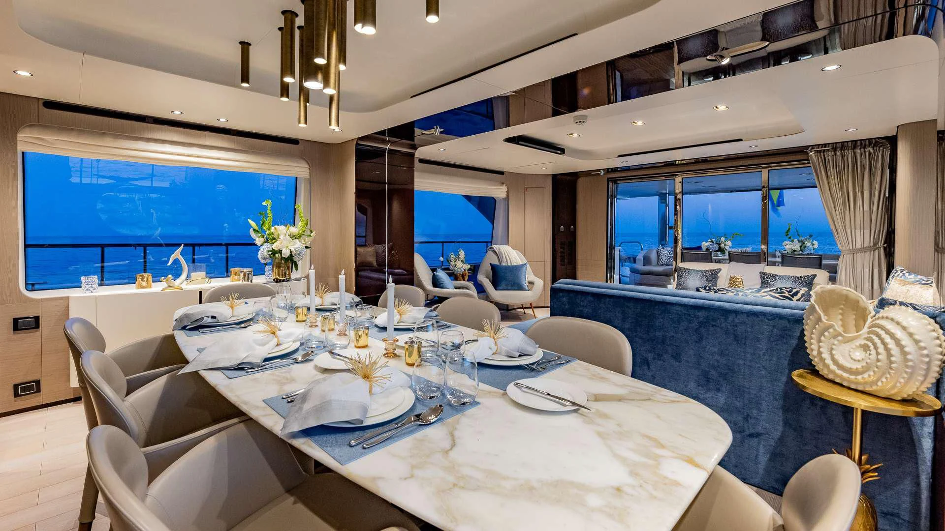 a room with a table and chairs aboard CAPTAIN MORGAN II Yacht for Sale