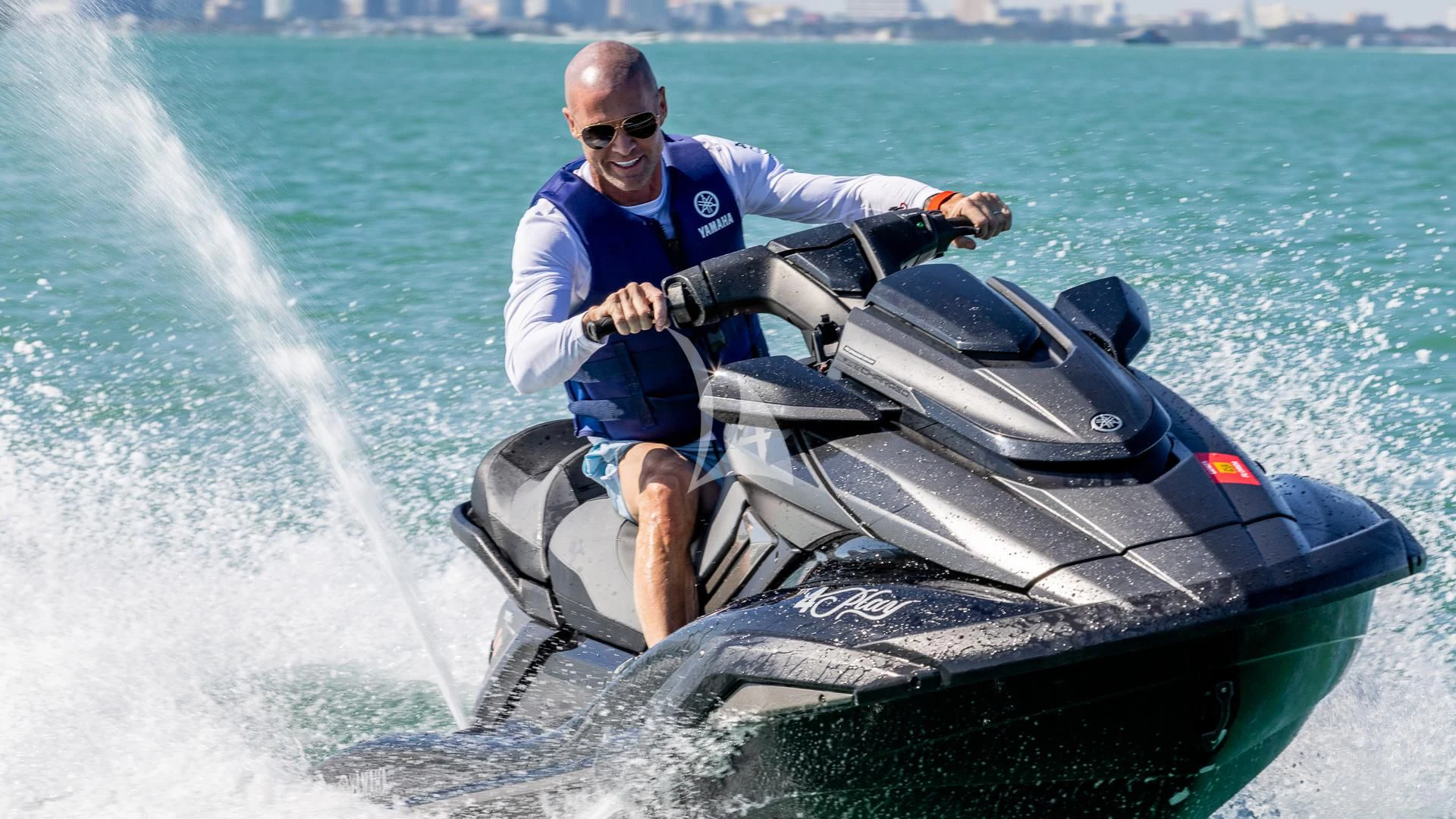 a man driving a jet ski aboard CAPTAIN MORGAN II Yacht for Sale