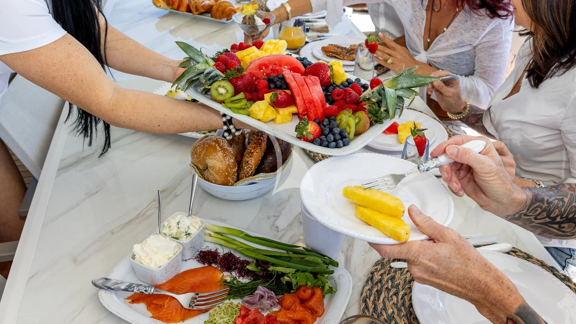 a group of people eating food aboard CAPTAIN MORGAN II Yacht for Sale