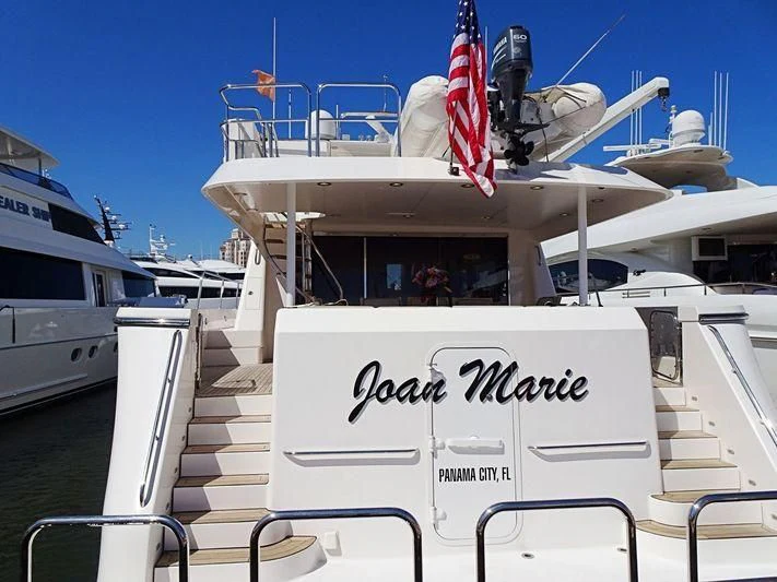 a boat with a flag on the front aboard LADY B Yacht for Sale