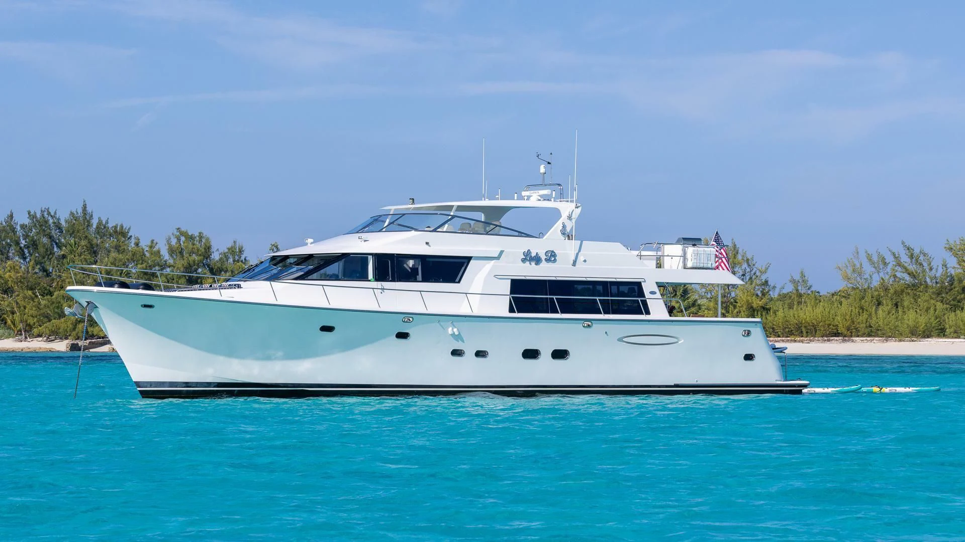 a white boat on the water aboard LADY B Yacht for Sale