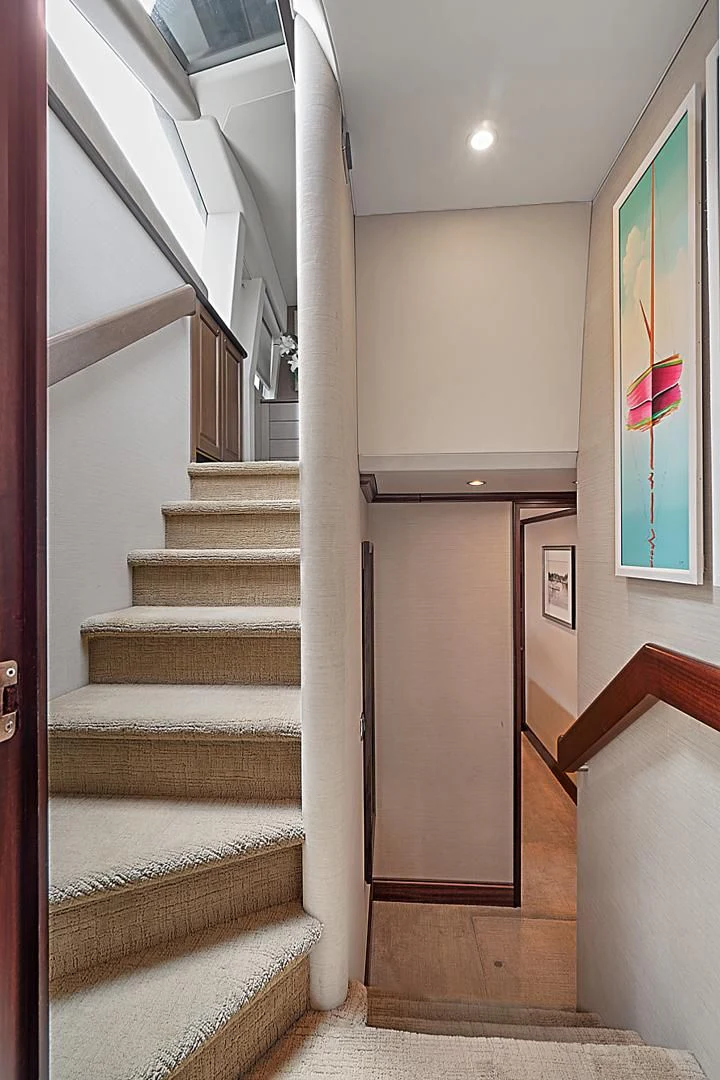 a staircase with a glass door aboard LADY B Yacht for Sale