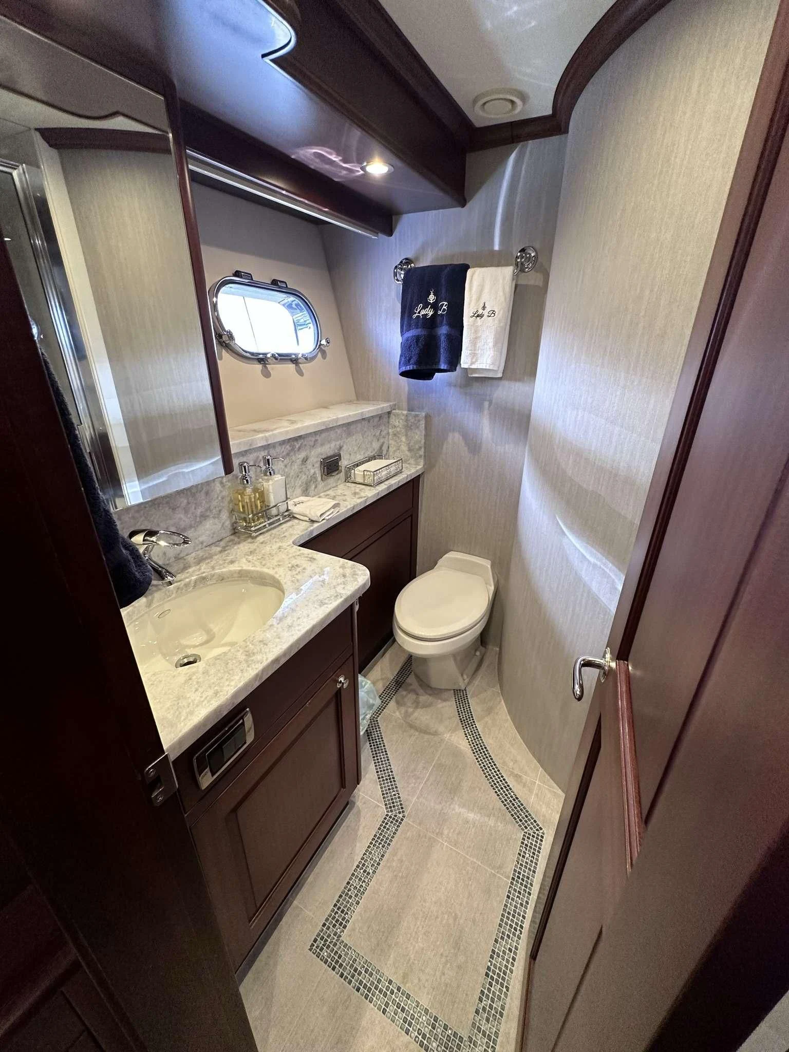a bathroom with a sink and toilet aboard LADY B Yacht for Sale