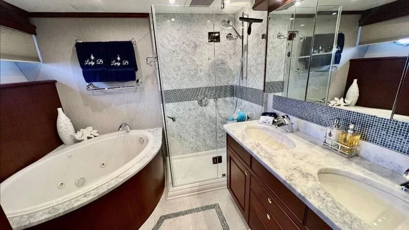 a bathroom with a large tub aboard LADY B Yacht for Sale