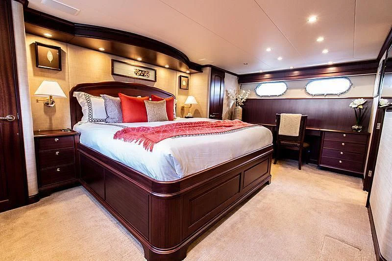 a hotel room with a bed and a desk aboard LADY B Yacht for Sale
