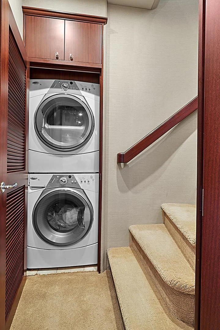 a washer and dryer in a room aboard LADY B Yacht for Sale