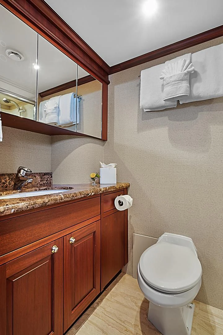 a bathroom with a toilet and a sink aboard LADY B Yacht for Sale