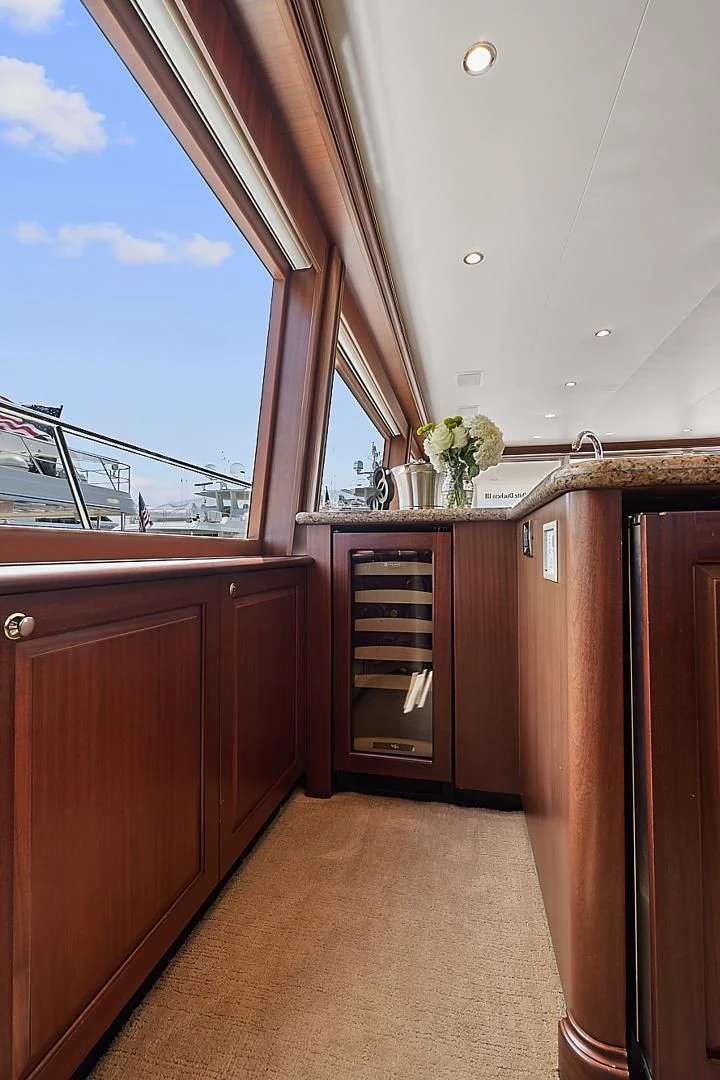 a kitchen with wooden cabinets aboard LADY B Yacht for Sale