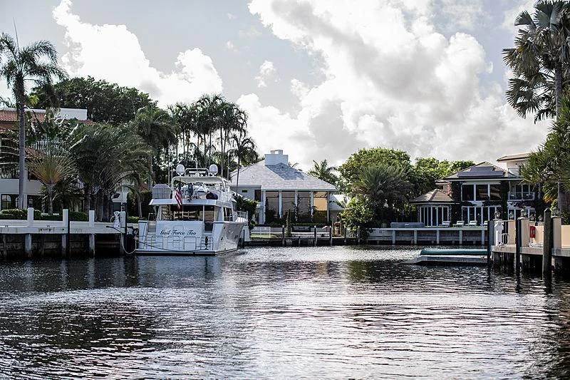 a boat docked at a pier aboard LADY B Yacht for Sale