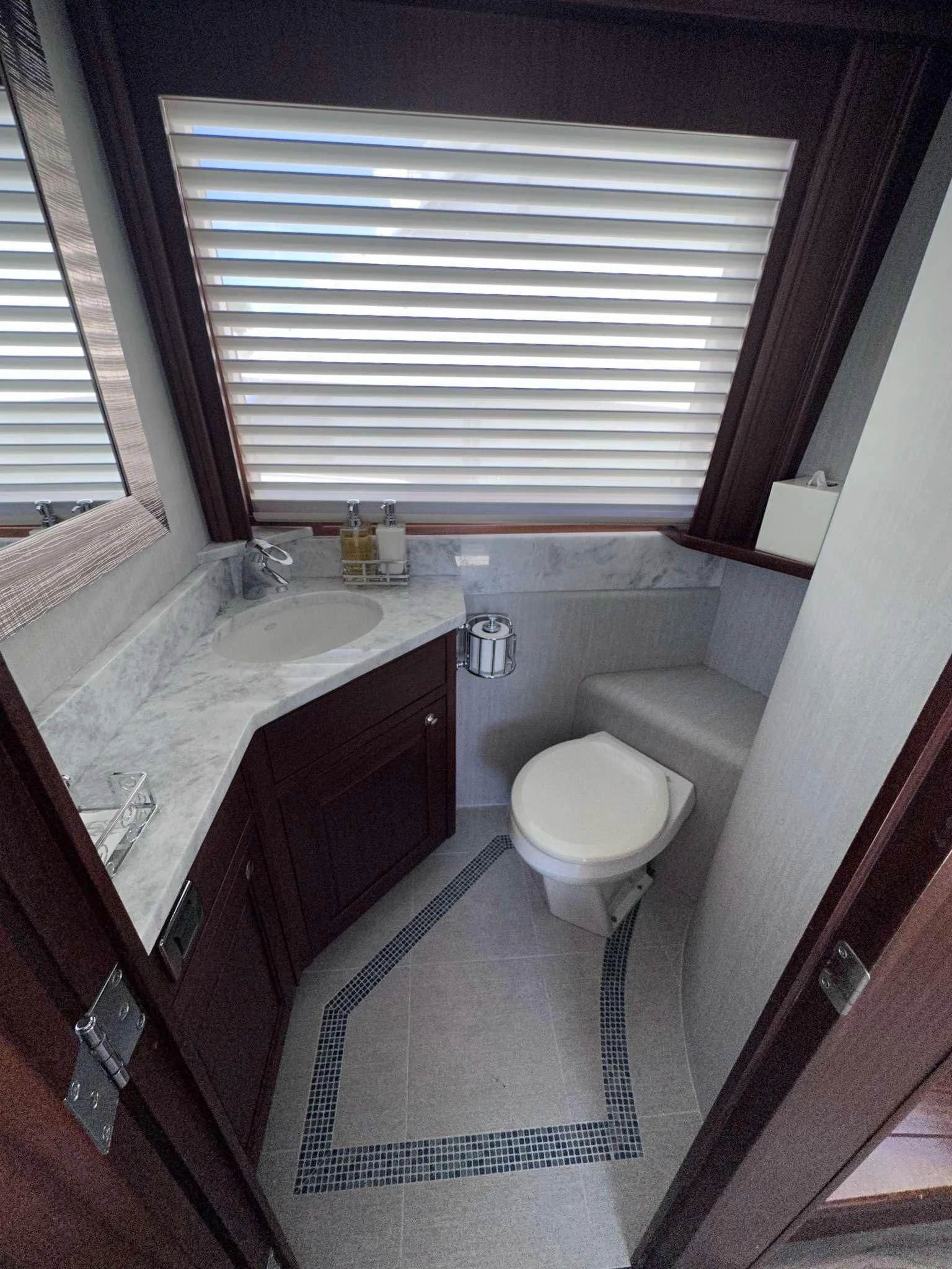 a bathroom with a sink toilet and a bathtub aboard LADY B Yacht for Sale