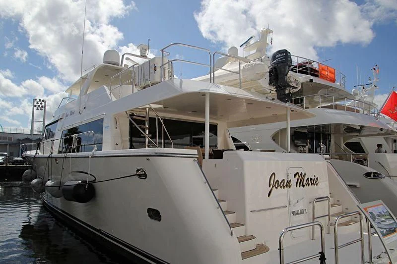 a white boat with a large piece of equipment on it aboard LADY B Yacht for Sale