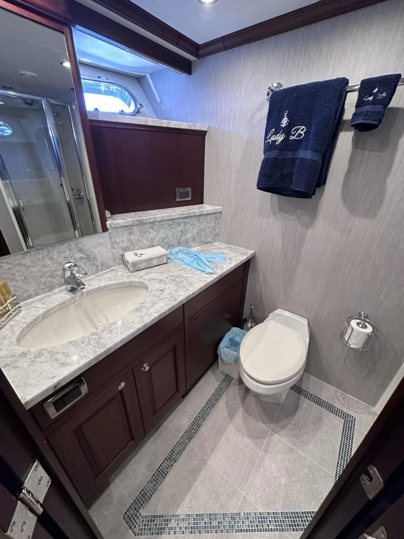 a bathroom with a sink and a toilet aboard LADY B Yacht for Sale