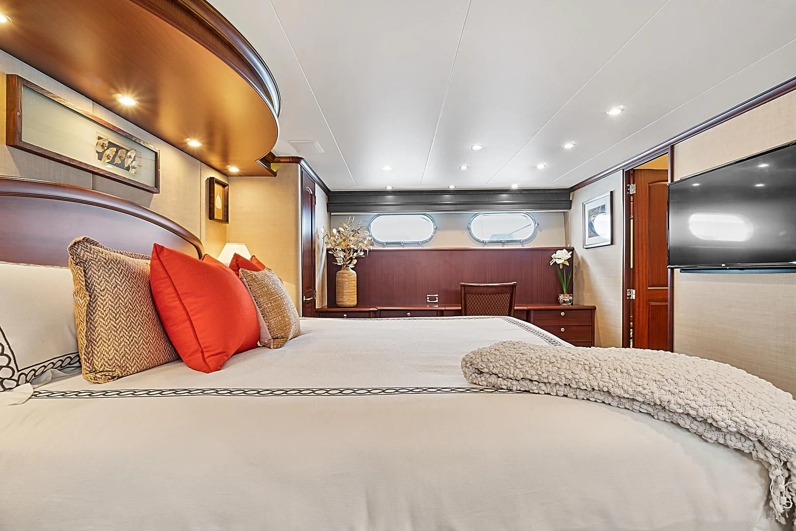 a bedroom with a bed and a television aboard LADY B Yacht for Sale