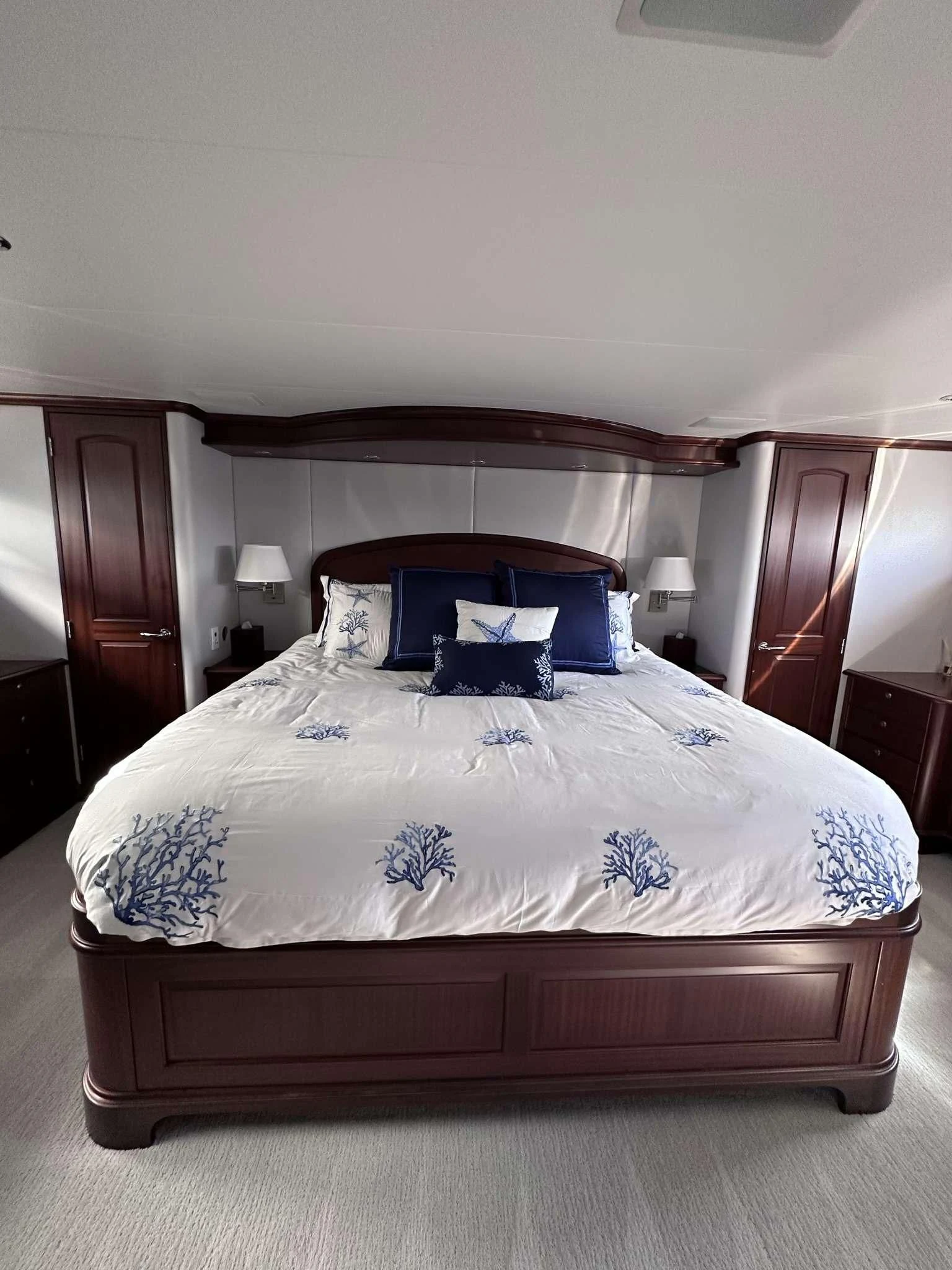 a bed with a blue pillow aboard LADY B Yacht for Sale