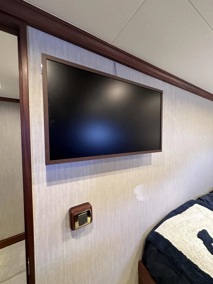 a tv on a wall aboard LADY B Yacht for Sale