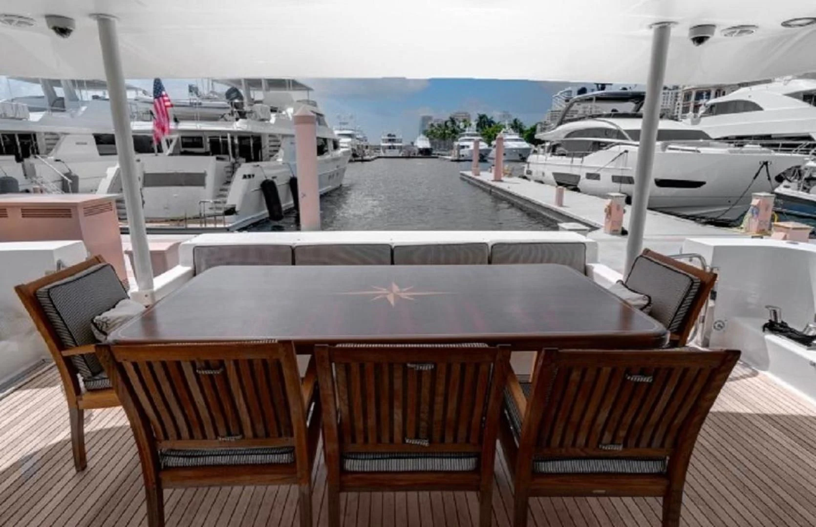 a table with chairs on it aboard LADY B Yacht for Sale