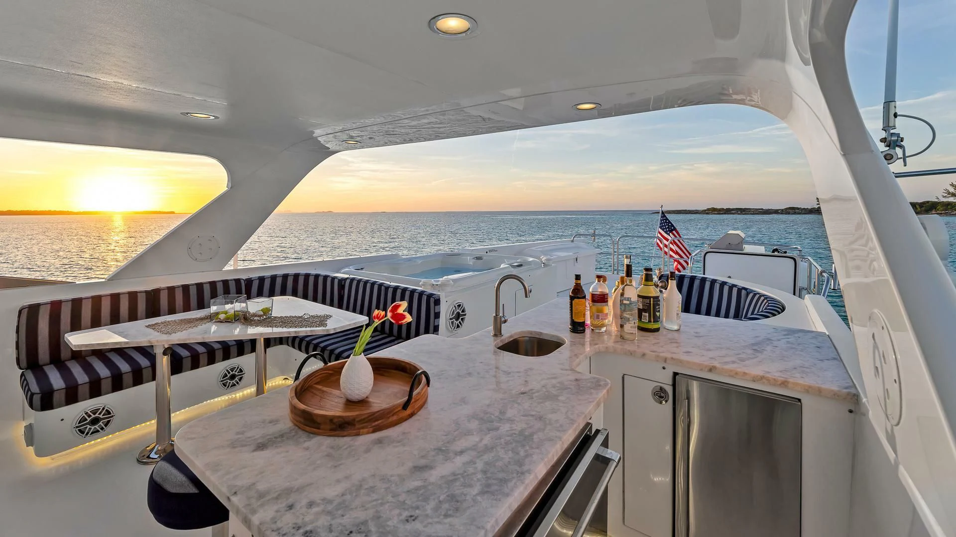 a boat with a bar and a table with a bowl on it aboard LADY B Yacht for Sale