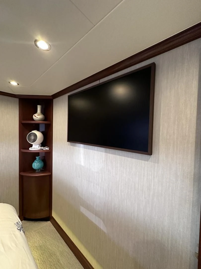 a tv on a wall aboard LADY B Yacht for Sale