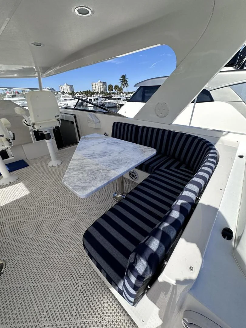 a black and white checkered table on a white car aboard LADY B Yacht for Sale