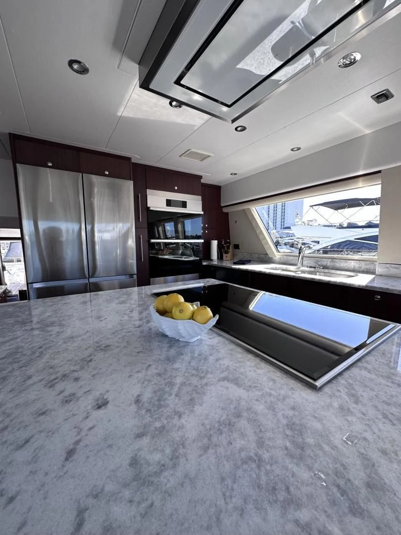 a kitchen with a bowl of fruit aboard LADY B Yacht for Sale