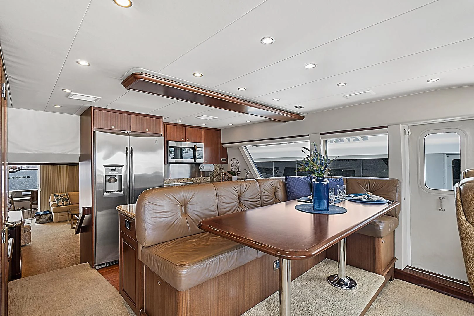 a living room with a couch and a table aboard LADY B Yacht for Sale