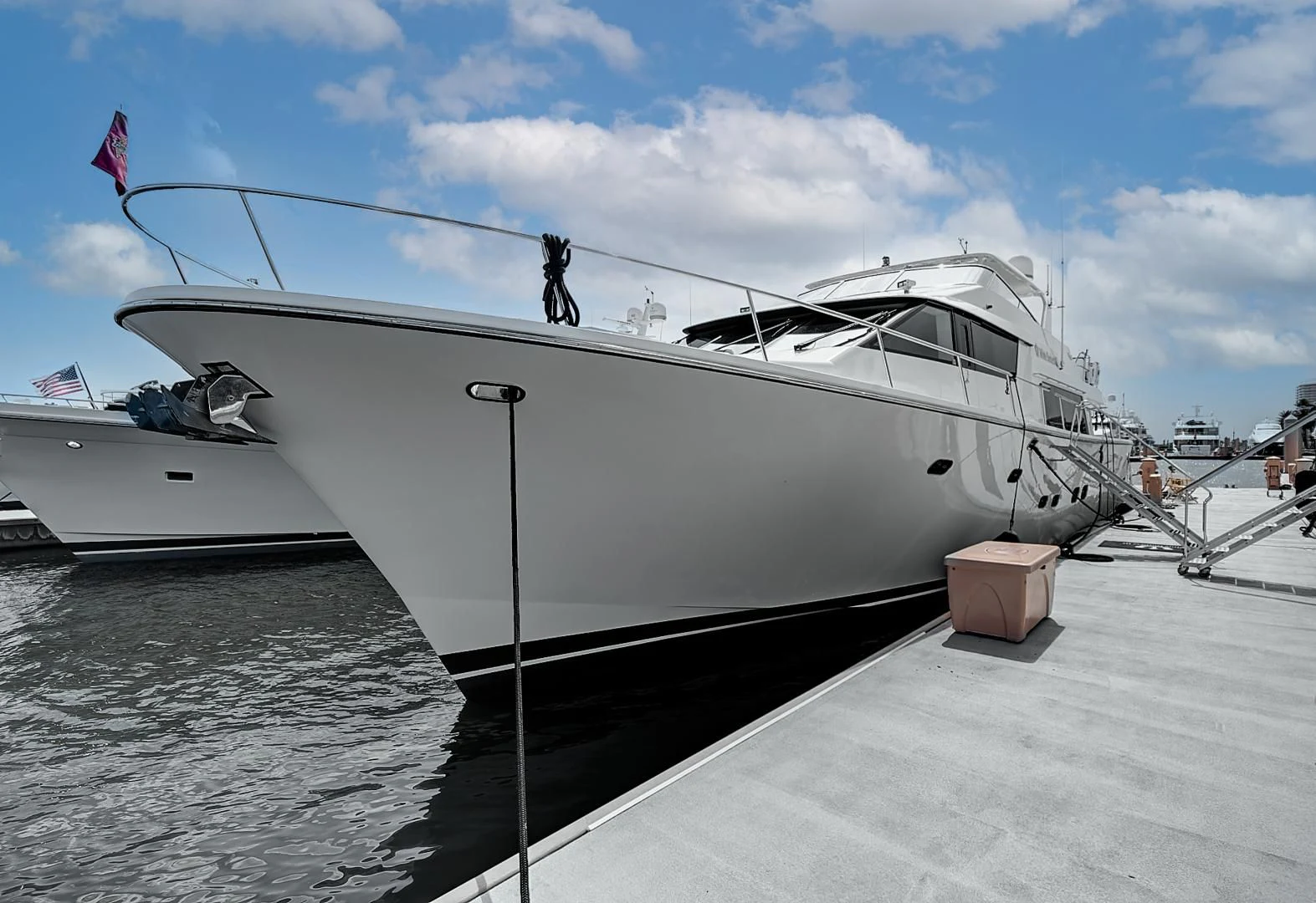 a white yacht docked aboard LADY B Yacht for Sale