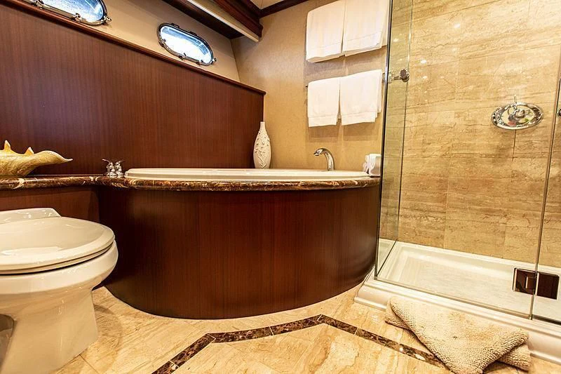 a bathroom with a tub and toilet aboard LADY B Yacht for Sale