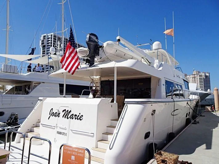 a boat with a flag on the front aboard LADY B Yacht for Sale