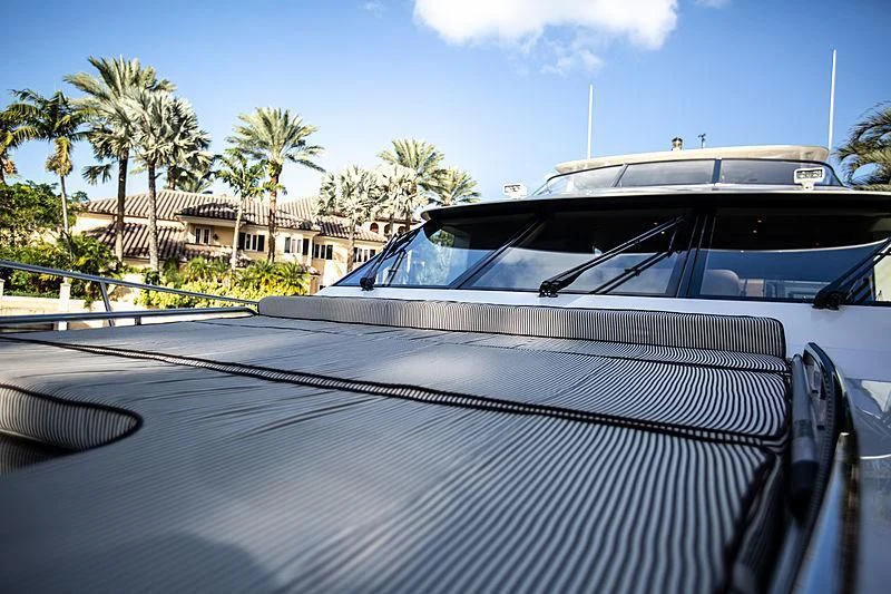 a white car parked in a parking lot aboard LADY B Yacht for Sale