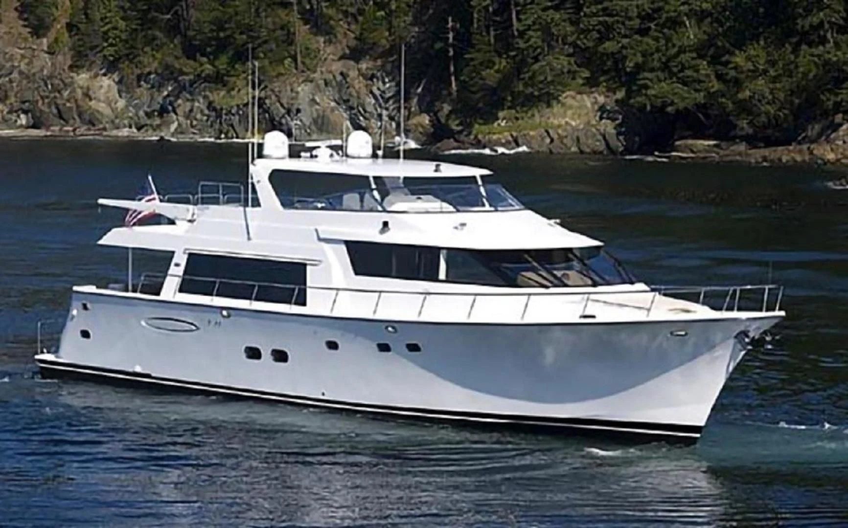 a white yacht on the water aboard LADY B Yacht for Sale