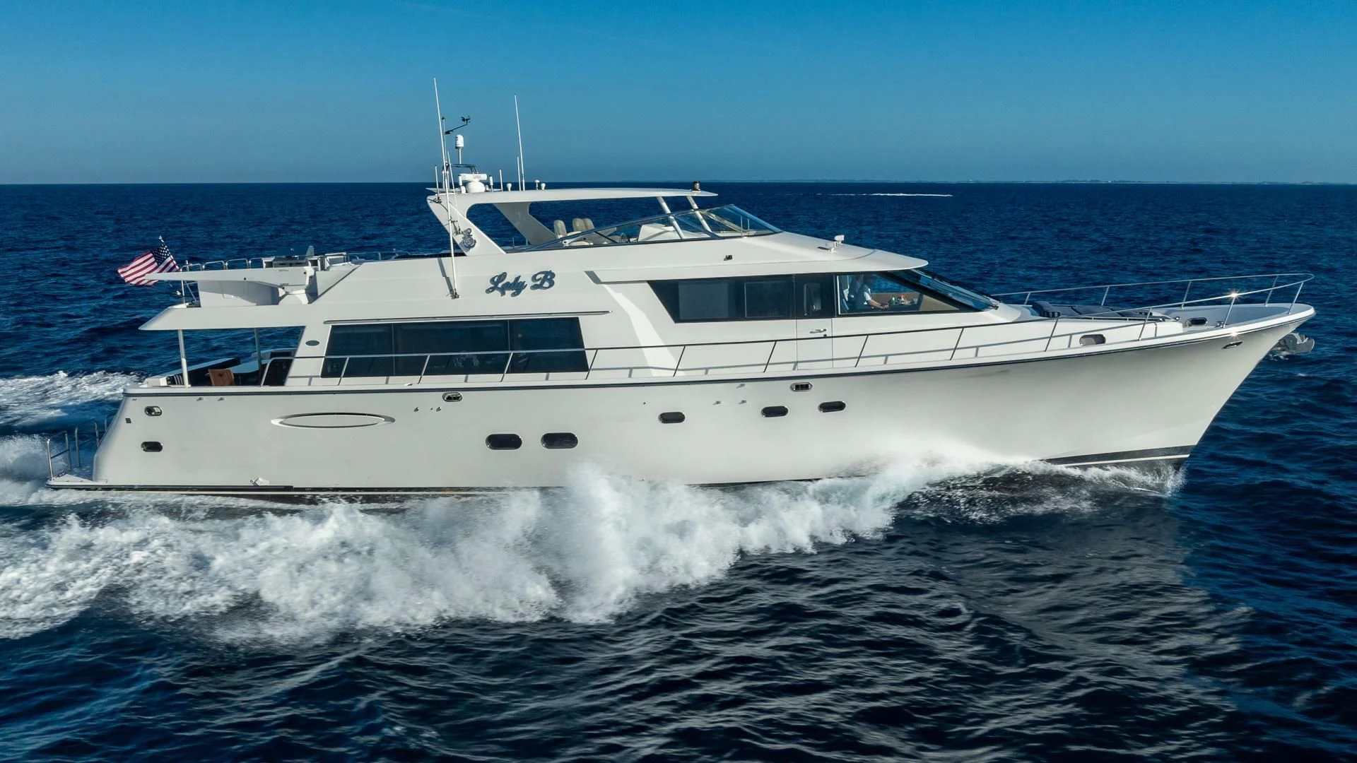 a white yacht on the water aboard LADY B Yacht for Sale