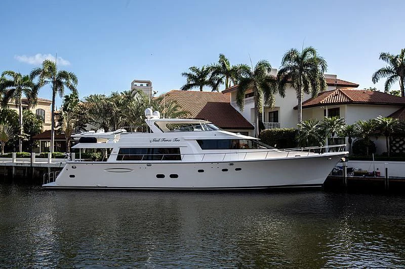 a boat on the water with Richard Nixon Presidential Library and Museum in the background aboard LADY B Yacht for Sale