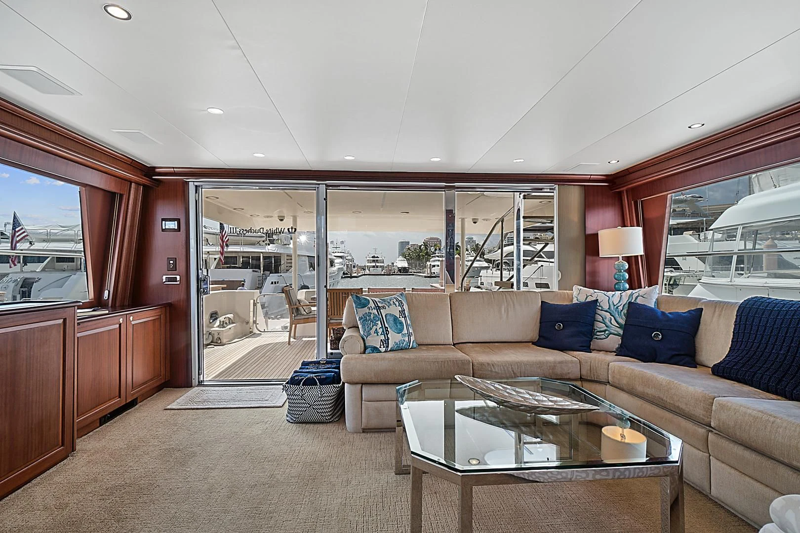 a living room with a couch and a table aboard LADY B Yacht for Sale