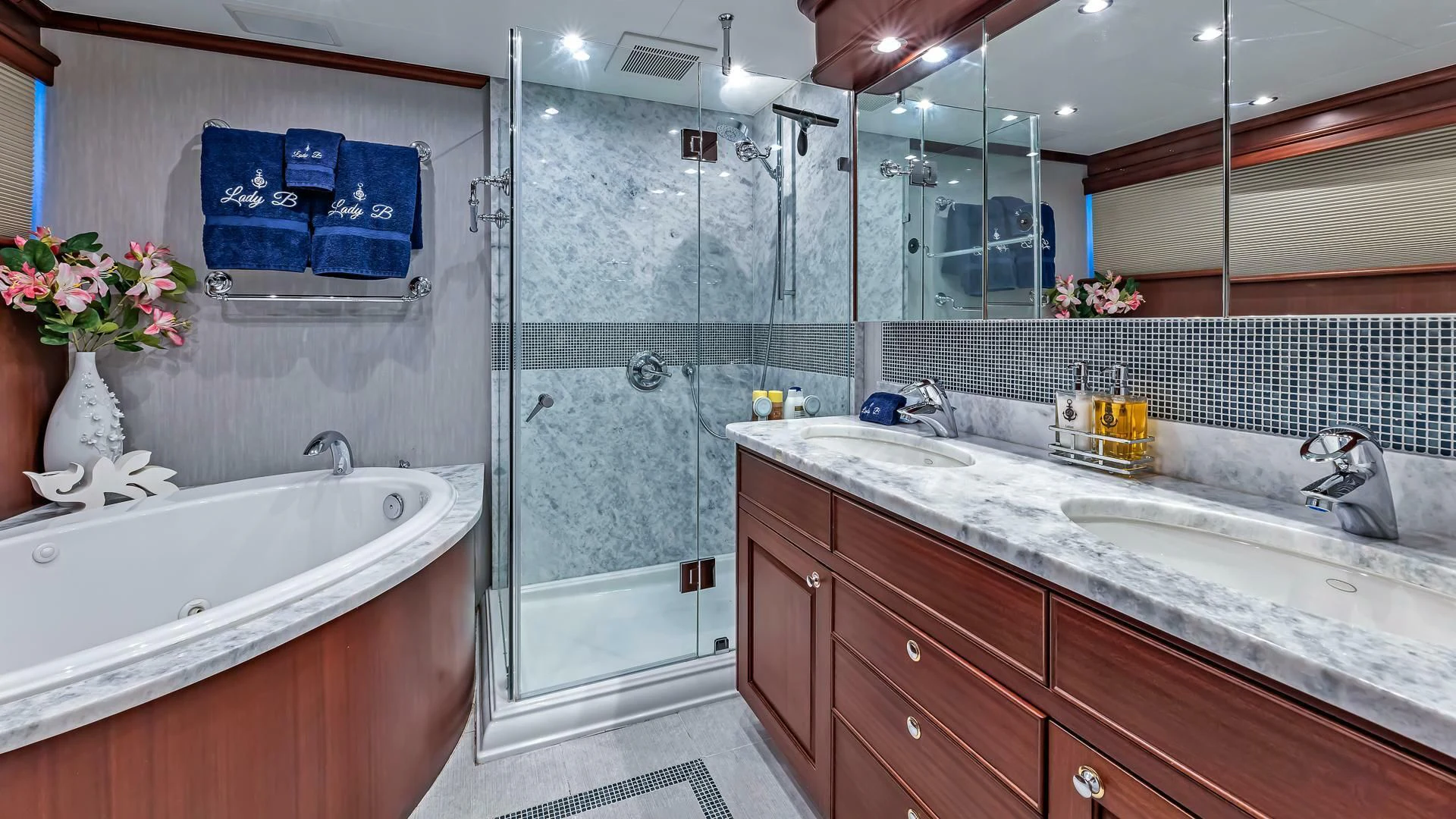 a bathroom with a glass shower aboard LADY B Yacht for Sale