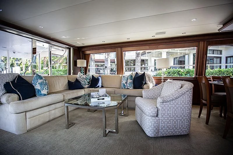 a living room with a couch and a coffee table aboard LADY B Yacht for Sale
