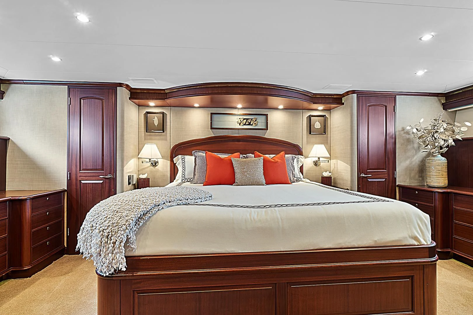 a bed with a white sheet and pillows on it aboard LADY B Yacht for Sale