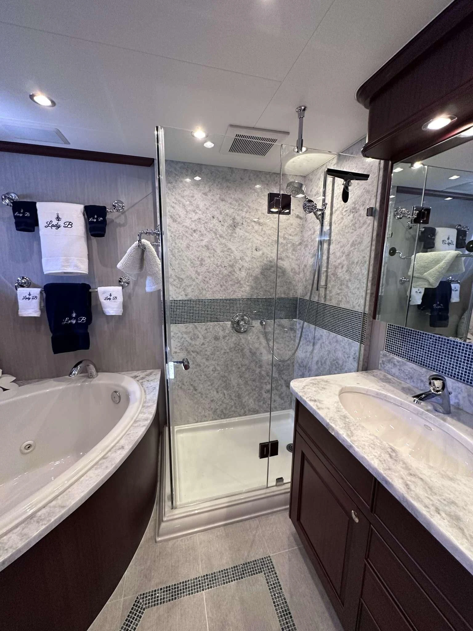 a bathroom with a shower and sink aboard LADY B Yacht for Sale