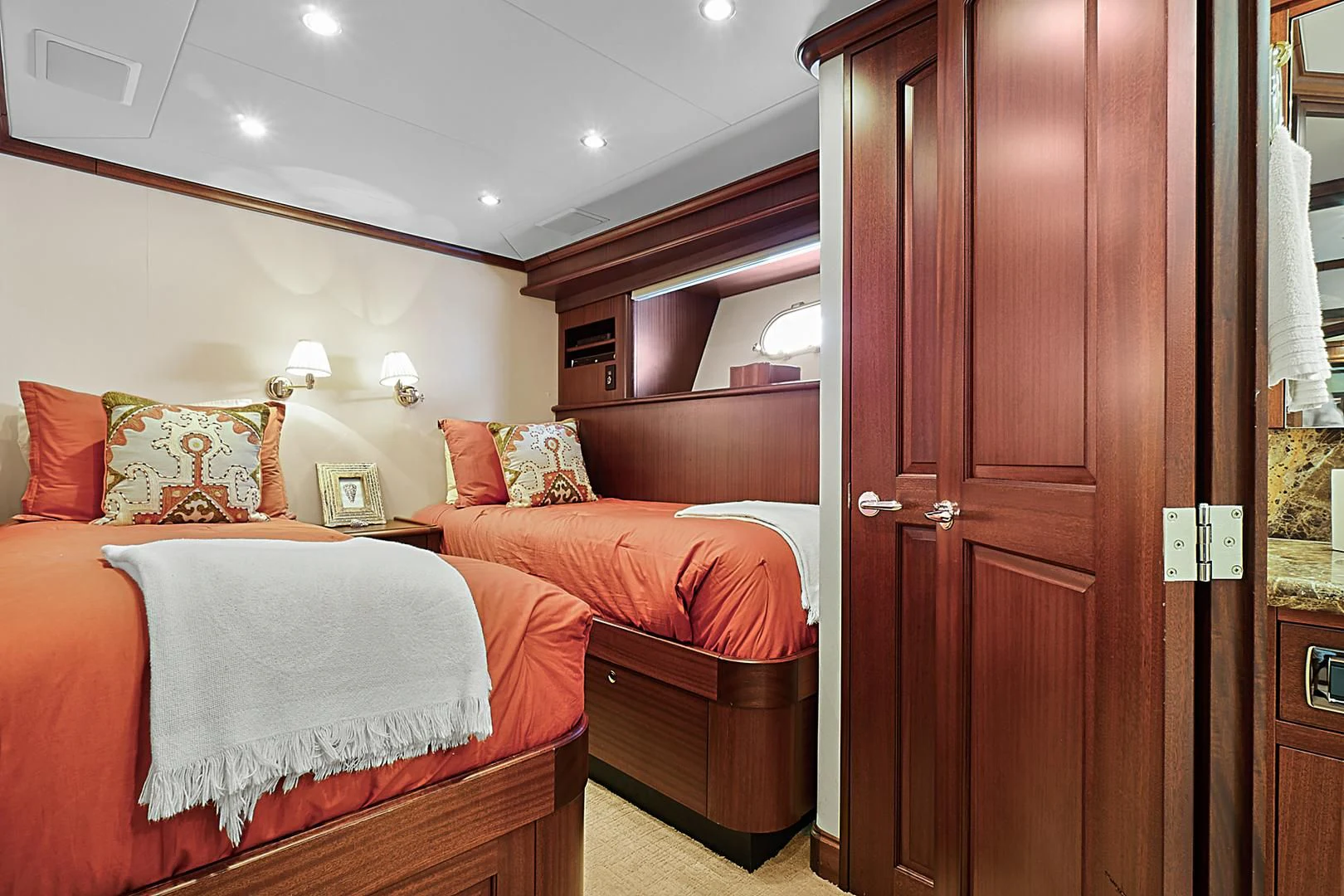 a room with a bed and a closet aboard LADY B Yacht for Sale