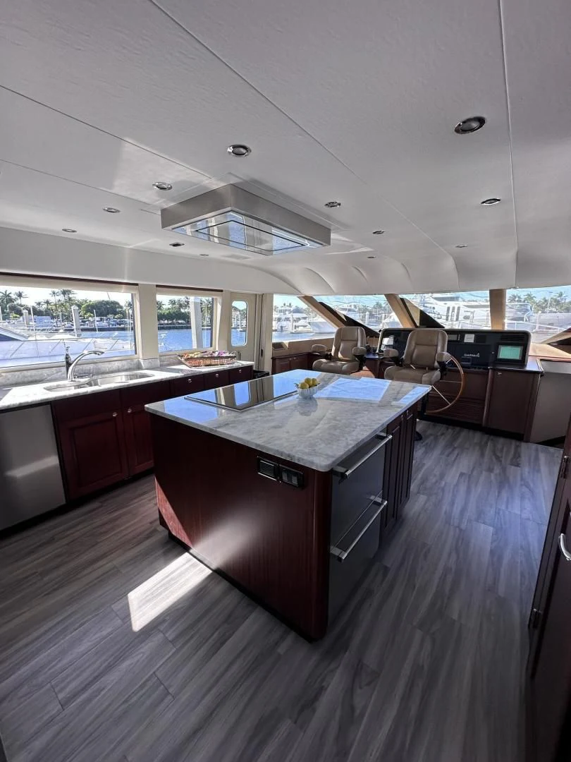 a large kitchen with a large island aboard LADY B Yacht for Sale