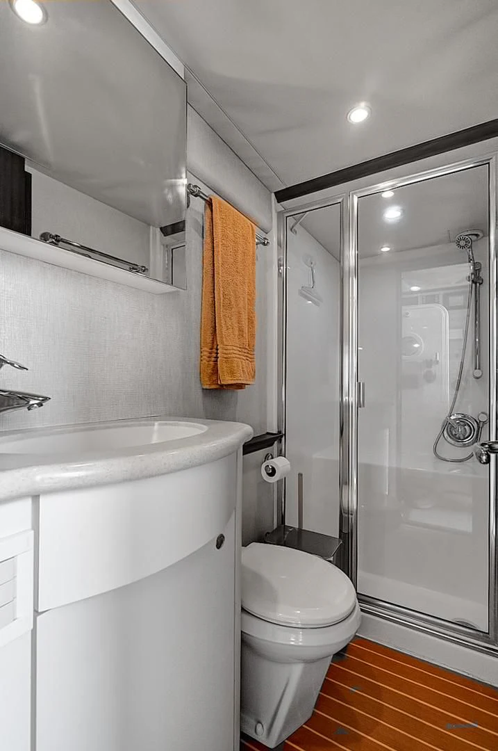 a bathroom with a glass shower aboard LADY B Yacht for Sale