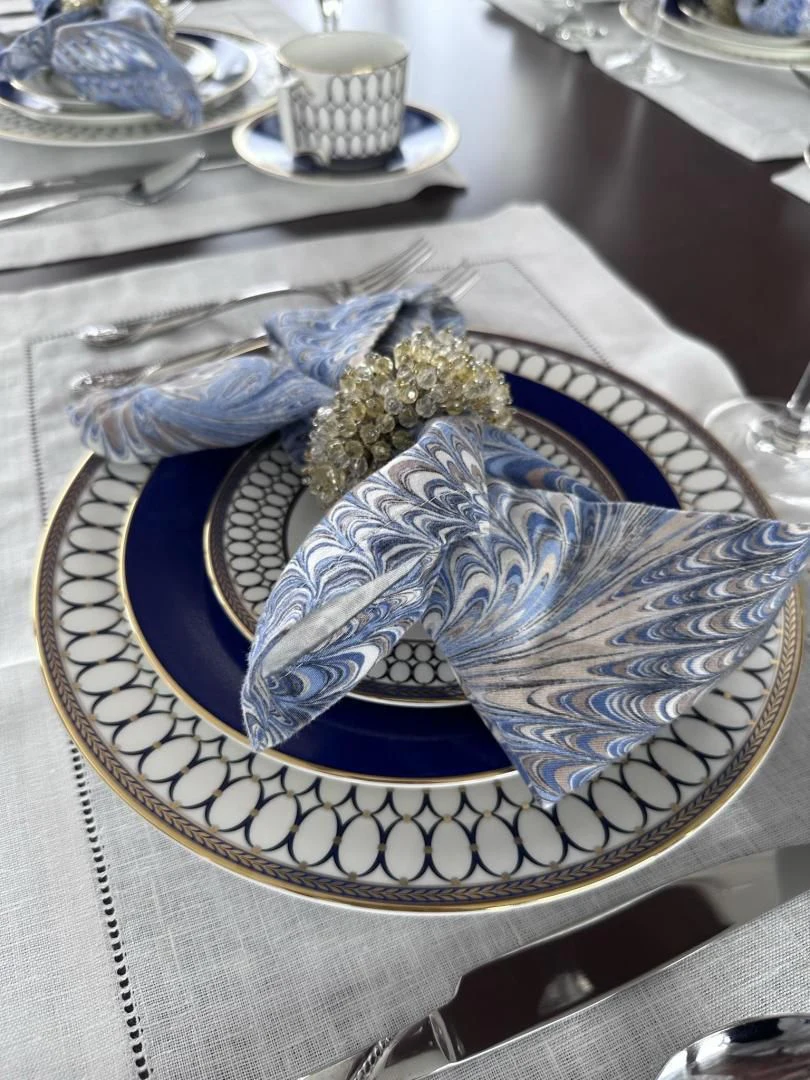 a blue and gold plate with a plant in it aboard LADY B Yacht for Sale