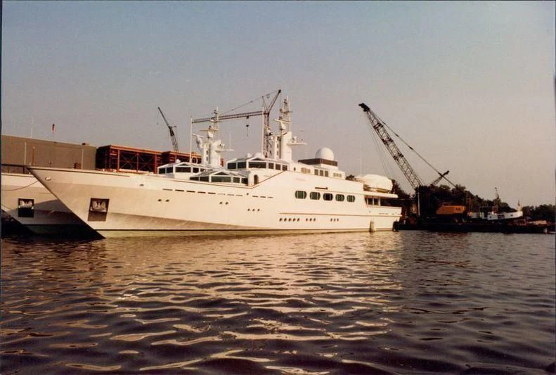 a large white boat in the water aboard PARAISO Yacht for Sale