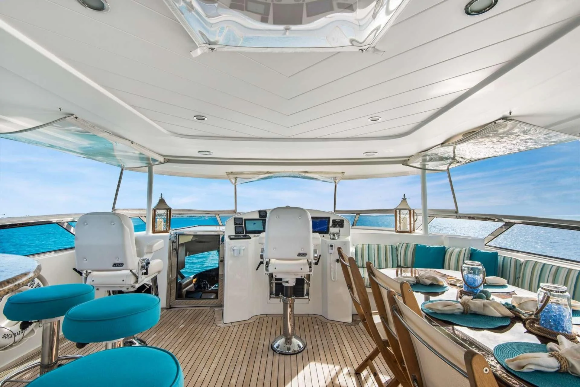 a boat with a table and chairs aboard PIPE DREAMS Yacht for Sale