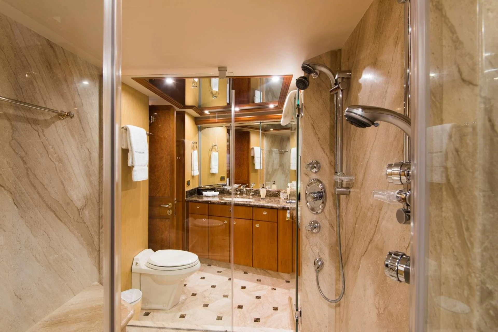 a bathroom with a glass shower aboard PIPE DREAMS Yacht for Sale