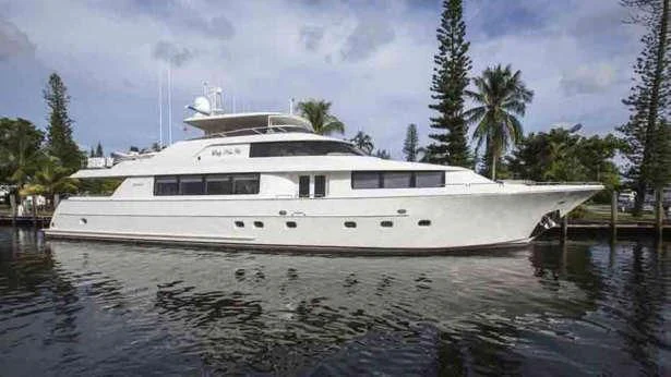 a white boat on a body of water aboard PIPE DREAMS Yacht for Sale